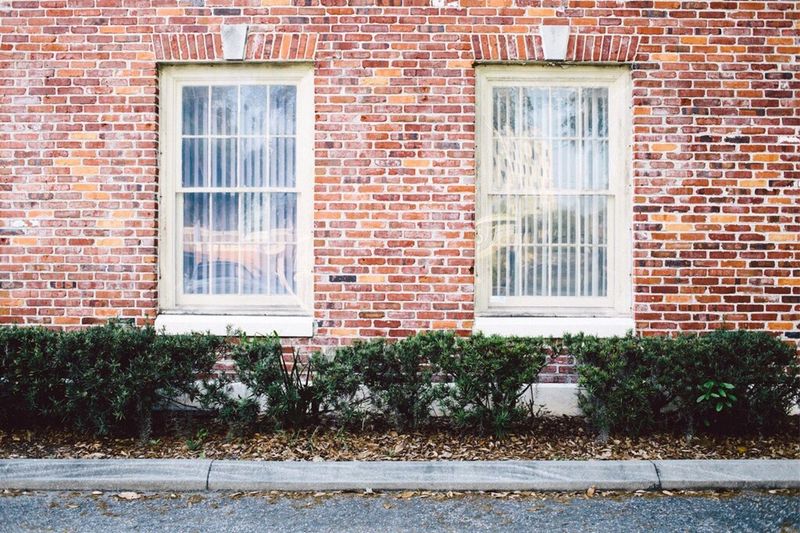 Close-up of brick wall with windows