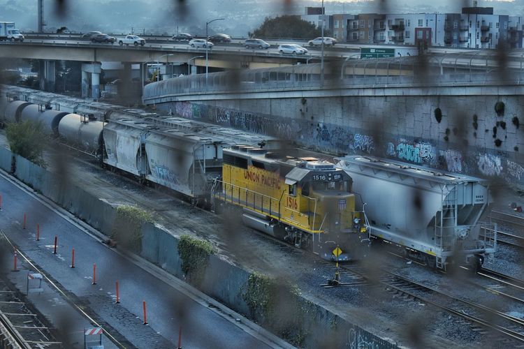 High angle view of train on railroad tracks seen through window