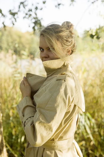 Rear view of woman standing on field