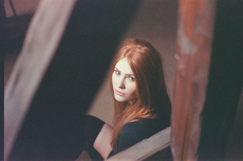 High angle view of young woman seen through railing