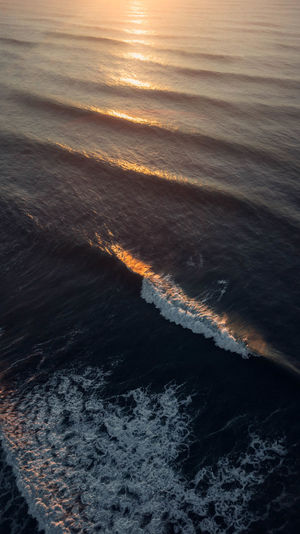 High angle view of sea at sunset