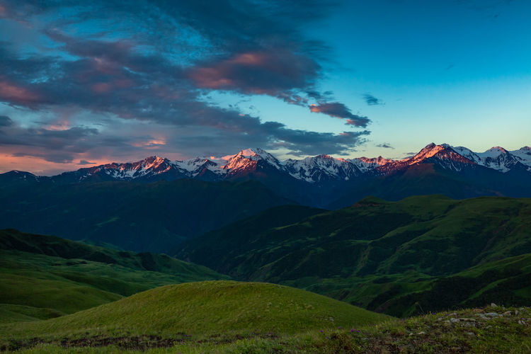 Sunset in the mountains of chechnya. scenic view of snowcapped mountains against sky during sunset