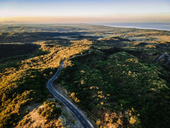 Aerial view of road amidst landscape against sky