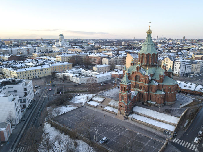 The uspenski cathedral in the front and the helsinki cathedral in the background. helsinki, finland.
