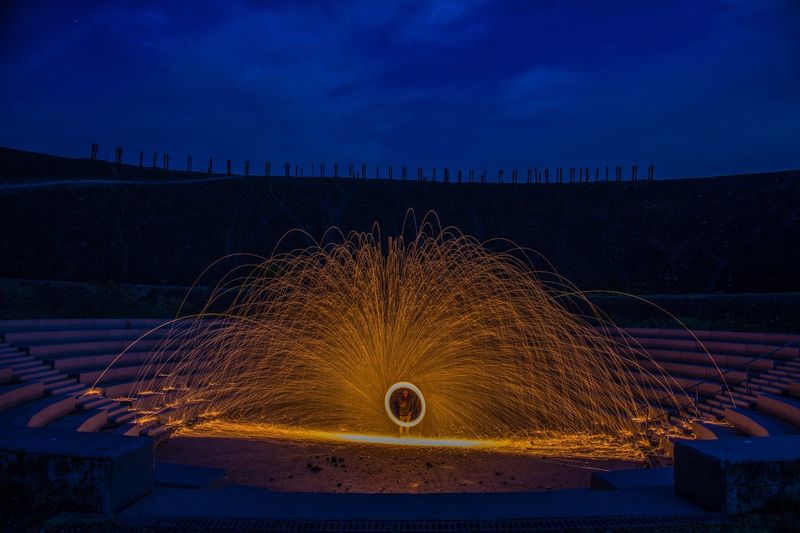 Person with wire wool standing in amphitheater