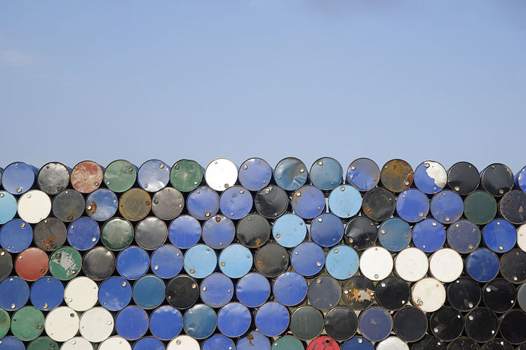 Stack of grunge oil tank barrel background- image
