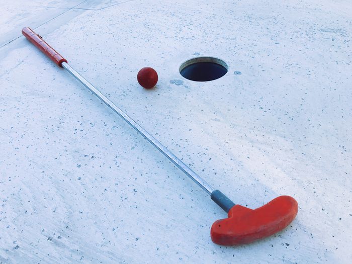 Miniature golf with ball on golf course