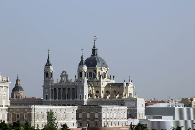Higher part of the almudena cathedral rising above the royal palace, madrid, spain.