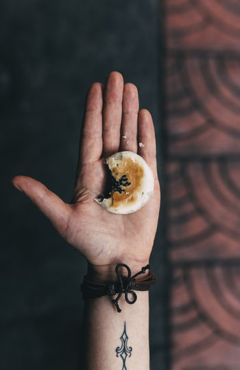 Sesame cookie Asian Food Bite Cake Cookie Food Food And Drink Holding Human Hand One Person Ready-to-eat Real People Sesame Sweet Food Tattoo Fresh on Market 2017 Food Stories