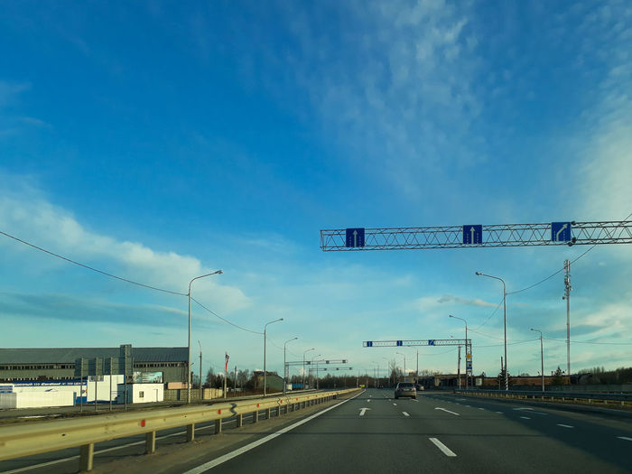 View of highway against blue sky