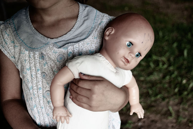 Low angle view of mother and daughter baby