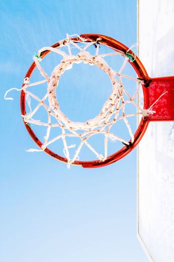 Directly below view of basketball hoop against clear sky