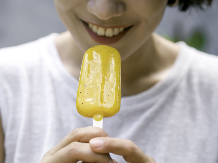 Close-up of woman holding ice cream