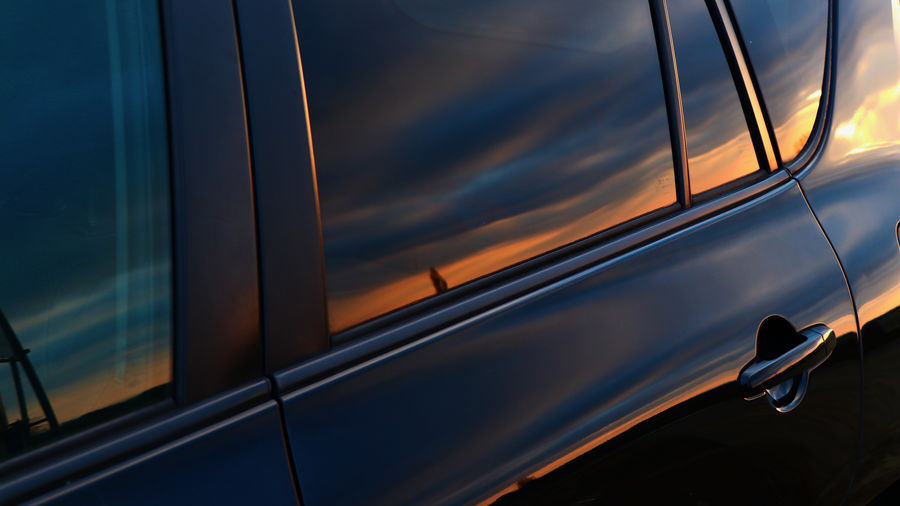 Reflection of sky on car window
