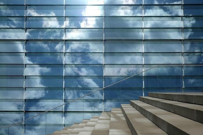 Reflection of clouds in office building