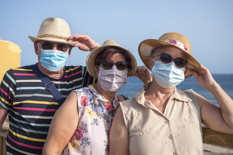 Portrait of senior people against sea