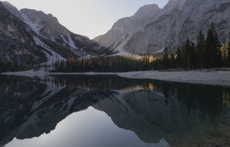Scenic view of lake and mountains against sky