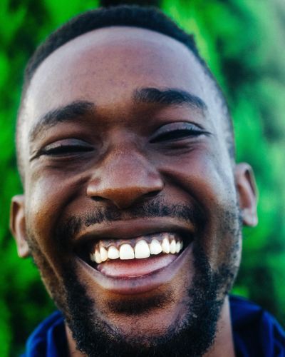 Close-up portrait of a smiling young man