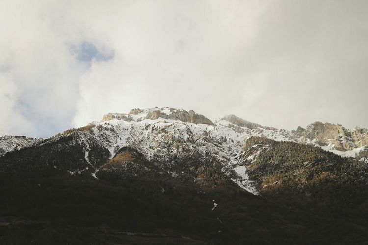 Scenic view of snow covered mountains