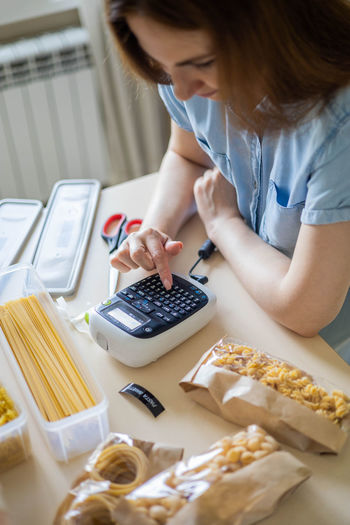 Midsection of woman working on table