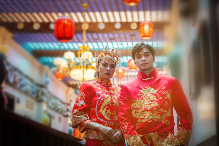 Portrait of young couple in traditional clothing