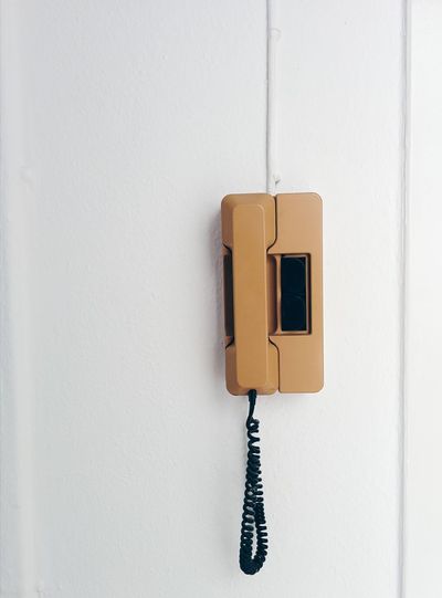 An intercom handset on a wall
