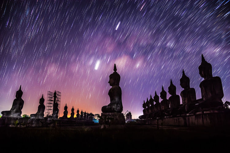 Panoramic view of temple against sky at night