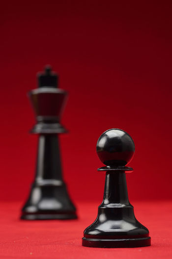 Close-up of chess against red background