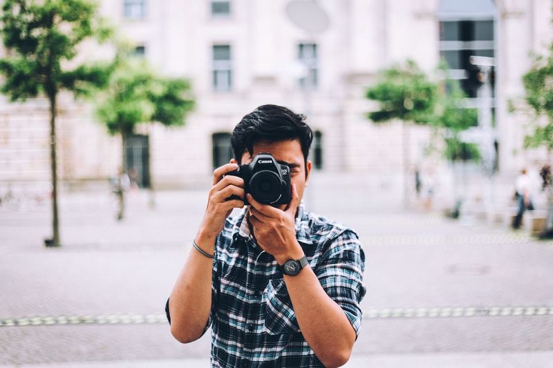 Man photographing with camera