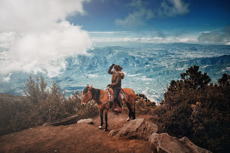 Woman riding horse in guatemala
