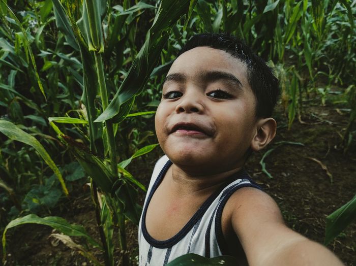 Simple photo of my son in my father corn farm,