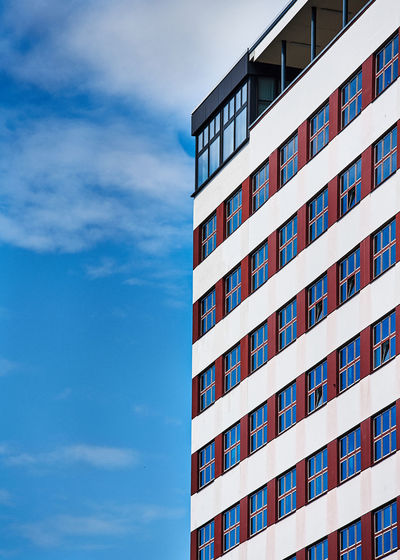 Low angle view of apartment building against sky