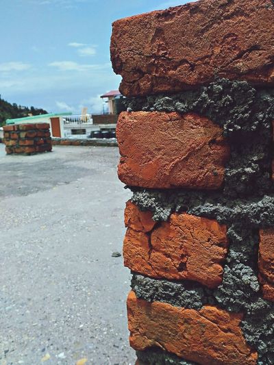 Close-up of stack against stone wall