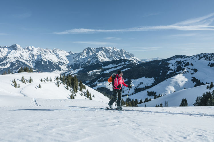 Woman ski touring in the austrian alps near hochkönig region, austria