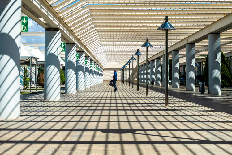 Side view of mature man standing on footbridge