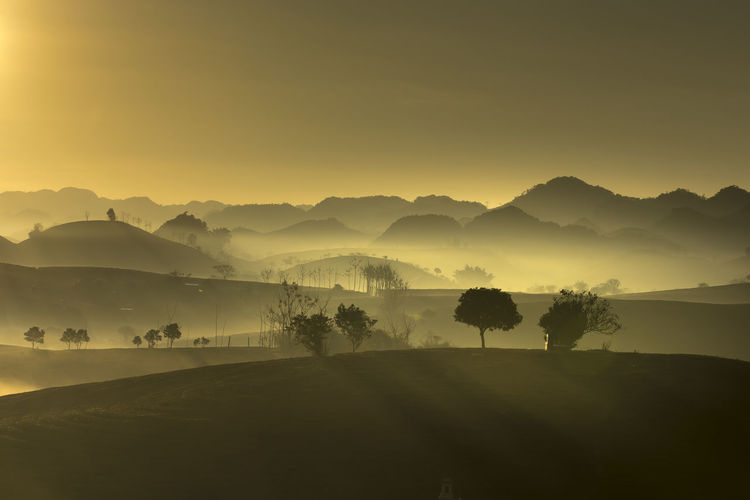 Scenic view of mountains against sky during sunset