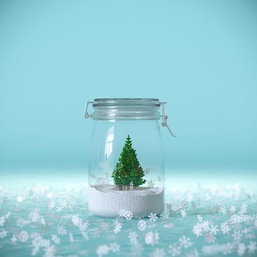 Close-up of glass jar on table against blue background