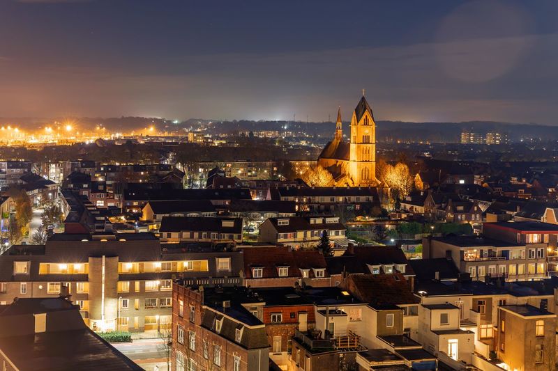High angle view of illuminated buildings in city