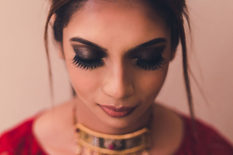 Close-up of young woman with false eyelashes