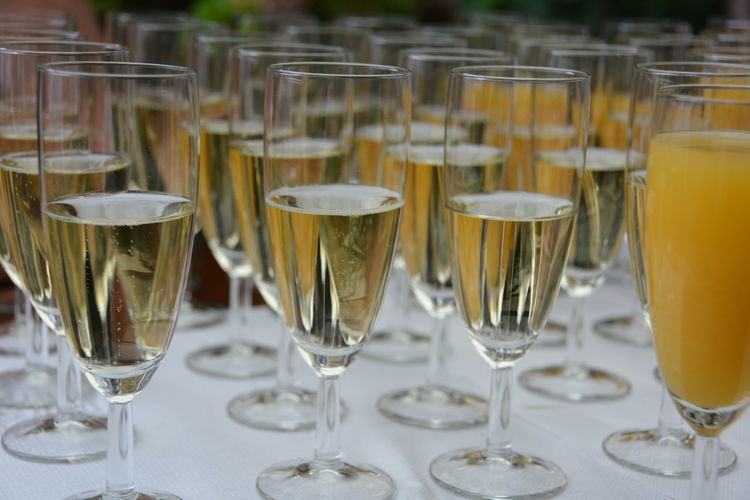 Close-up of alcohol glasses on table at wedding reception