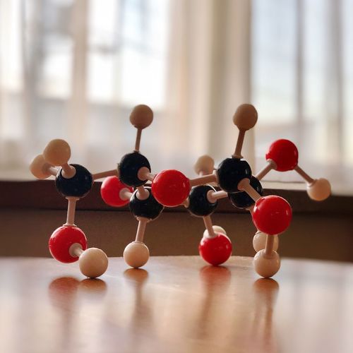Close-up of molecules model on wooden table
