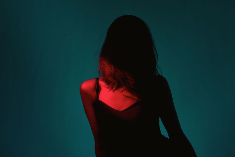 Cold, calculated. Red And Blue Color Gels Red Studio Shot Long Hair One Person Standing Indoors Young Adult Women Young Women One Young Woman Only One Woman Only Adult People Adults Only Day EyeEm Ready AI Now Visual Creativity HUAWEI Photo Award: After Dark