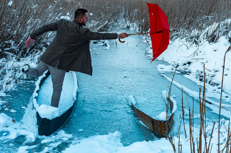 Man on snow covered field