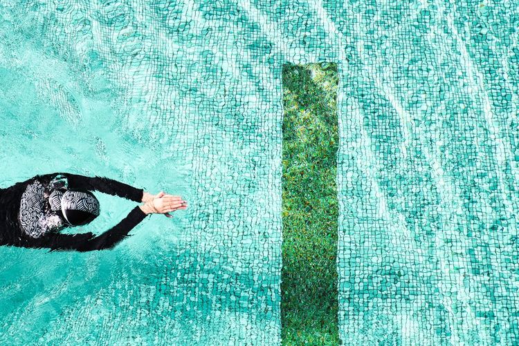 High angle view of person swimming in swimming pool