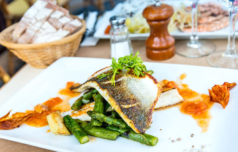 Close-up of cooked fish with asparagus