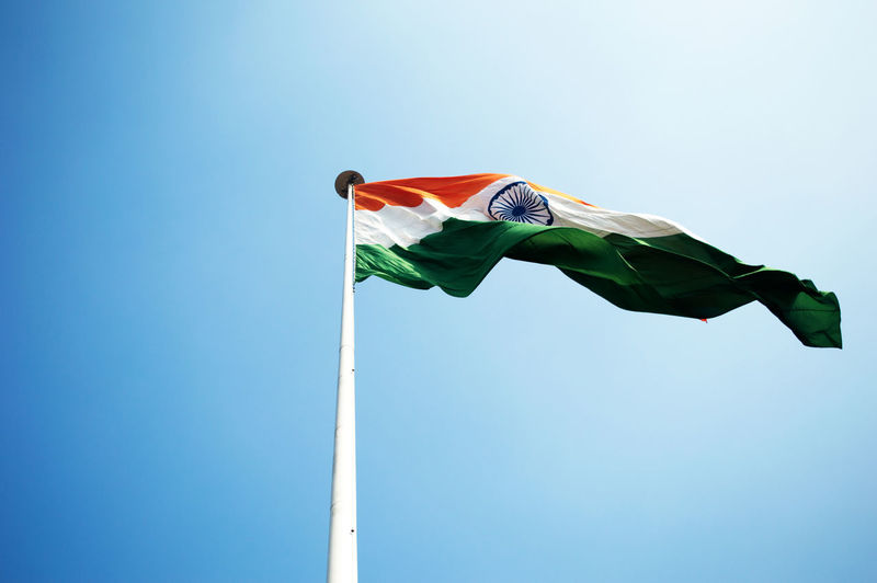 Low angle view of indian flag against clear sky