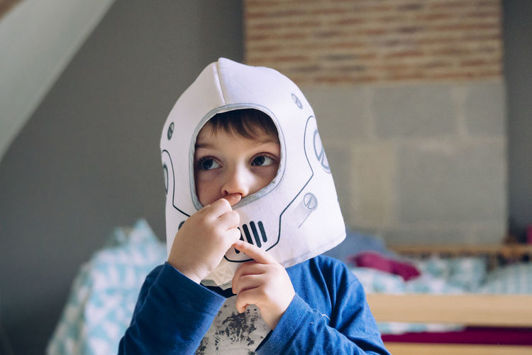 Portrait of cute boy holding camera