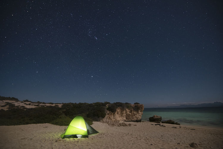 A tent at night in a beach at del carmen island in loreto