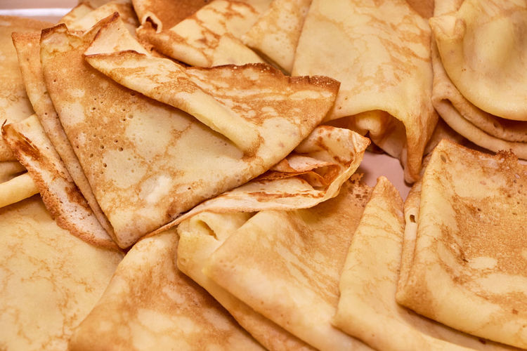 Blini russian crepes served folded on a dish