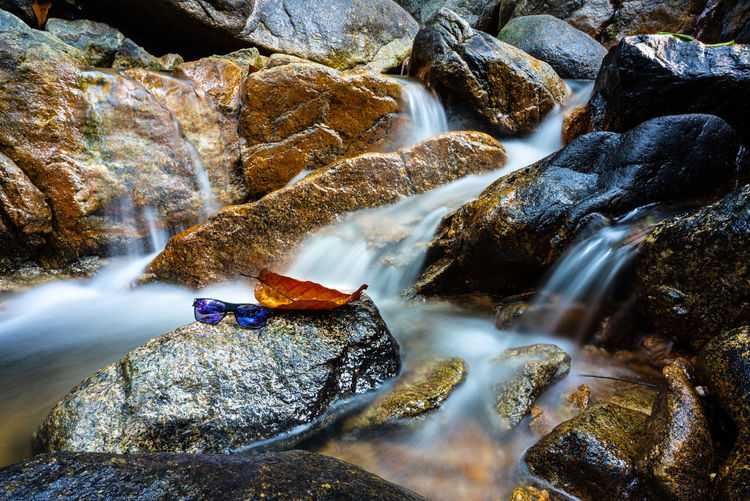 Scenic view of waterfall in sea